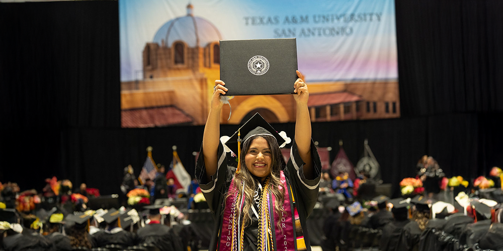 Student holding diploma