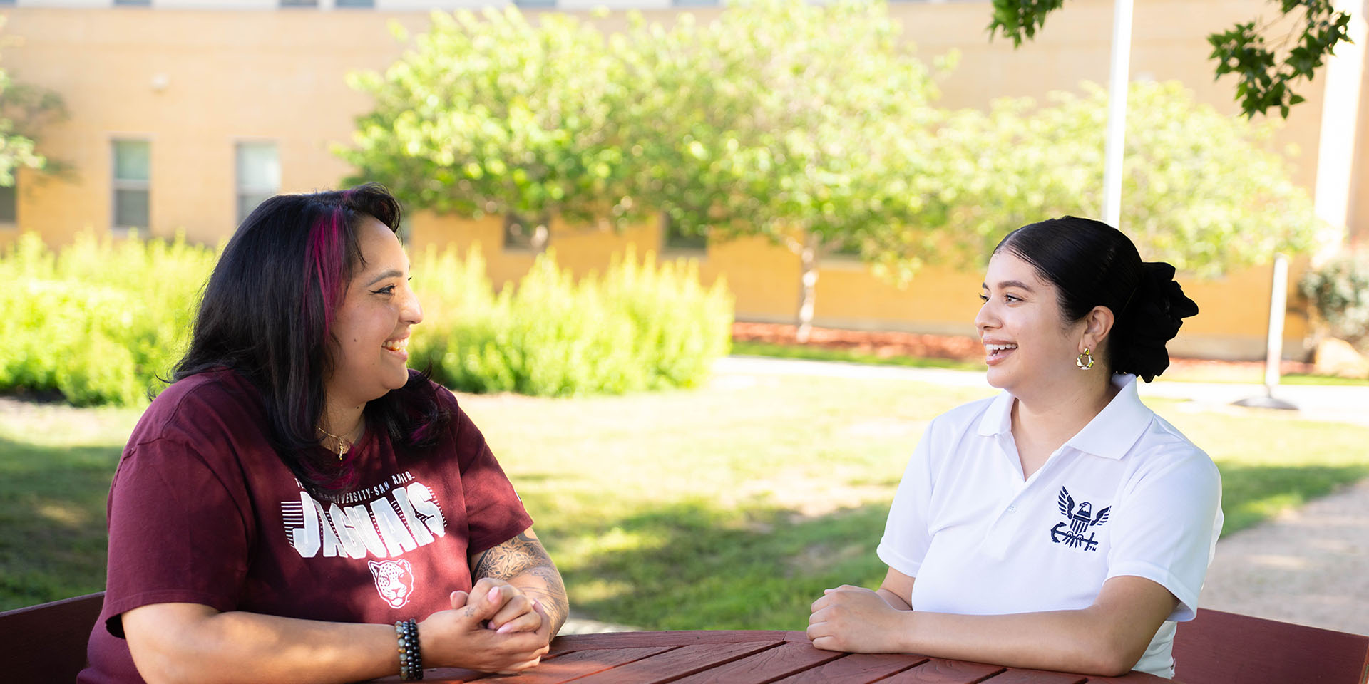 Students speaking in outdoor space