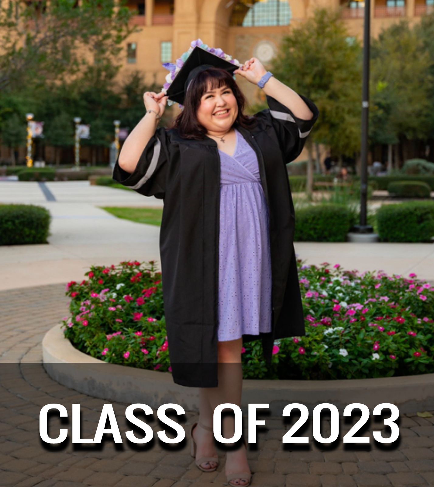 Villegas posing on campus in her cap and gown.
